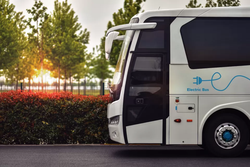 Close-up of front side of white electric bus